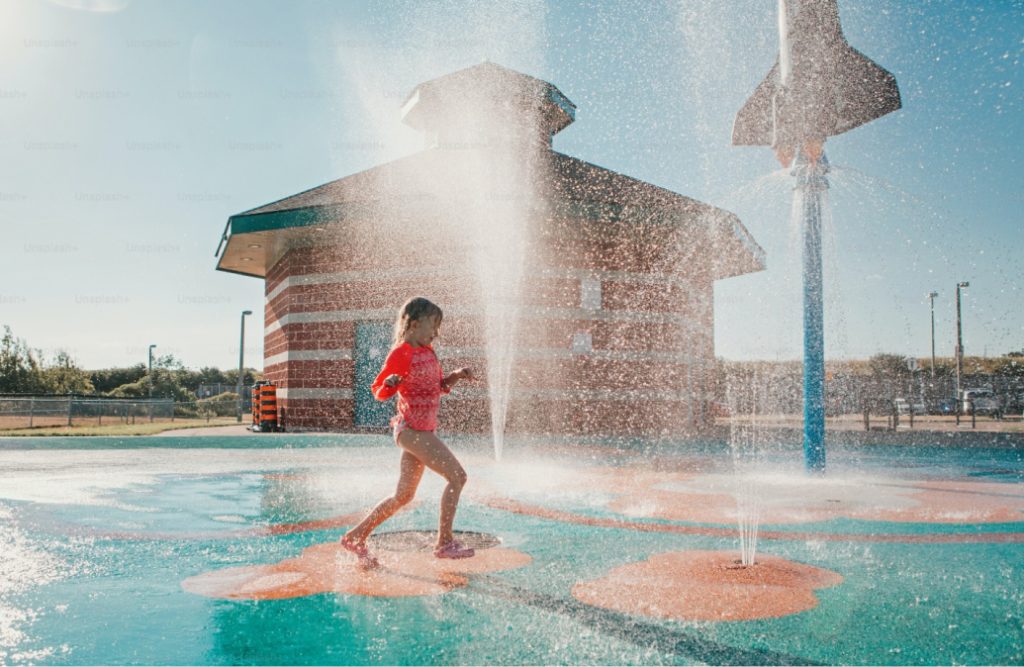 child playing in waterpark
